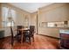 Cozy dining area with built-in cabinets, vintage wallpaper, and a table with classic chairs at 285 Kennesaw Nw Ave, Marietta, GA 30060