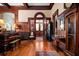 Entryway featuring dark wood trim, a grand piano, and a beautiful stained-glass door at 285 Kennesaw Nw Ave, Marietta, GA 30060