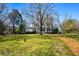 Grand Victorian home with sprawling lawn and mature trees, offering timeless elegance at 285 Kennesaw Nw Ave, Marietta, GA 30060