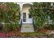 Charming front entrance with flower trees, steps and iron handrails at 285 Kennesaw Nw Ave, Marietta, GA 30060