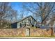 Garage behind a stone wall and arched gate at 285 Kennesaw Nw Ave, Marietta, GA 30060