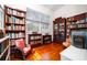 Bright room with beautiful hardwood floors with multiple bookshelves, and large windows at 285 Kennesaw Nw Ave, Marietta, GA 30060
