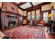 Spacious living room with hardwood floors, a fireplace, and elegant furniture creating a welcoming atmosphere at 285 Kennesaw Nw Ave, Marietta, GA 30060