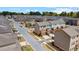 Aerial view of townhome community showcasing multiple townhomes with back patios and garages at 3420 Reagan Way, Lawrenceville, GA 30044