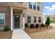 Charming brick home entrance with manicured landscaping and a welcoming walkway at 3420 Reagan Way, Lawrenceville, GA 30044