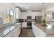 Modern kitchen featuring granite countertops, stainless steel appliances, and ample cabinet space at 3420 Reagan Way, Lawrenceville, GA 30044