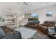 Bright and open living space featuring modern furniture and a view of the kitchen at 3420 Reagan Way, Lawrenceville, GA 30044