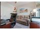 Cozy home office with a comfortable sofa and a modern desk setup at 3420 Reagan Way, Lawrenceville, GA 30044
