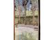 Private backyard patio surrounded by mature trees and landscaping at 4428 Wilkerson Manor Se Dr # 6, Smyrna, GA 30080