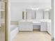 Bright bathroom featuring a double sink vanity, soaking tub, and walk-in shower at 4428 Wilkerson Manor Se Dr # 6, Smyrna, GA 30080