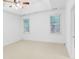 Bedroom with tray ceiling, fan, and natural light from the large windows at 4428 Wilkerson Manor Se Dr # 6, Smyrna, GA 30080