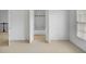 Bedroom featuring neutral carpet and an open doorway to an en-suite bathroom at 4428 Wilkerson Manor Se Dr # 6, Smyrna, GA 30080