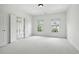 Bright bedroom features neutral carpet, white walls and trim, as well as a bath and dual windows at 4428 Wilkerson Manor Se Dr # 6, Smyrna, GA 30080