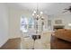 Dining area with natural light and transitional views into the living spaces at 4428 Wilkerson Manor Se Dr # 6, Smyrna, GA 30080