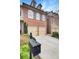 Charming brick townhome with a two-car garage and well-maintained landscaping at 4428 Wilkerson Manor Se Dr # 6, Smyrna, GA 30080