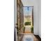 Inviting foyer view through an open door, showcasing a brick pathway and lush landscaping at 4428 Wilkerson Manor Se Dr # 6, Smyrna, GA 30080