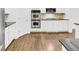 Modern kitchen with stainless steel appliances, granite countertops, and dark hardwood floors at 4428 Wilkerson Manor Se Dr # 6, Smyrna, GA 30080