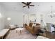 Open-concept living room with a cozy seating area and views into the kitchen and dining space at 4428 Wilkerson Manor Se Dr # 6, Smyrna, GA 30080