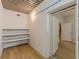 Versatile basement space with finished flooring, exposed ceiling, and storage shelves for customization at 452 Hightower Ridge Rd, Covington, GA 30014