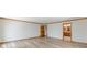 Bedroom with wood floors, wood trim and doorways with access to an ensuite bathroom at 452 Hightower Ridge Rd, Covington, GA 30014