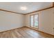 Bedroom with a large window overlooking the outside view and plank flooring at 452 Hightower Ridge Rd, Covington, GA 30014