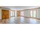 Bedroom with wood floors, wood trim and many closets and windows with a wooded view at 452 Hightower Ridge Rd, Covington, GA 30014
