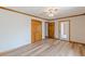 Bedroom with wood floors, fan, and a closet and door leading to a screened outdoor room at 452 Hightower Ridge Rd, Covington, GA 30014