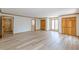 Bedroom with wood floors, wood trim and many closets, door, and windows with a wooded view at 452 Hightower Ridge Rd, Covington, GA 30014