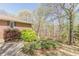 Brick home with manicured landscaping and mature trees at 452 Hightower Ridge Rd, Covington, GA 30014