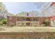 Brick home with a covered patio, upper level balconies, and a spiral staircase at 452 Hightower Ridge Rd, Covington, GA 30014