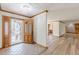 Bright foyer with tile flooring and an open view to the living spaces and front door at 452 Hightower Ridge Rd, Covington, GA 30014
