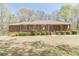Charming brick home with a well-maintained lawn, mature trees, and inviting curb appeal at 452 Hightower Ridge Rd, Covington, GA 30014