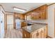 Traditional kitchen featuring granite countertops, wood cabinets, and natural light at 452 Hightower Ridge Rd, Covington, GA 30014