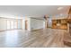 Large living room featuring hardwood floors, natural light, and a brick fireplace at 452 Hightower Ridge Rd, Covington, GA 30014