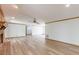 Bright living room with hardwood floors, white walls, and a brick fireplace at 452 Hightower Ridge Rd, Covington, GA 30014