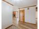 Open living space featuring hardwood floors, white walls, and a brick fireplace at 452 Hightower Ridge Rd, Covington, GA 30014