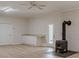 Spacious living room boasting a white brick wall and wood-burning stove at 452 Hightower Ridge Rd, Covington, GA 30014