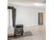 Cozy living room featuring a rustic stove and ample natural light at 452 Hightower Ridge Rd, Covington, GA 30014