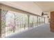 The large porch offers ample space and views of a natural setting at 452 Hightower Ridge Rd, Covington, GA 30014