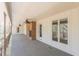 Enjoy serene views from the covered porch with brick detailing and nature all around at 452 Hightower Ridge Rd, Covington, GA 30014