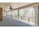 The porch with ceiling fans provides a relaxing view of the surrounding nature at 452 Hightower Ridge Rd, Covington, GA 30014