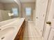 Bright bathroom featuring double sink vanity with white countertop and a large mirror at 512 Clearwater Dr, Mcdonough, GA 30252