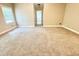 Spacious carpeted bedroom with natural light at 512 Clearwater Dr, Mcdonough, GA 30252