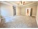Carpeted bedroom with open door and neutral colors at 512 Clearwater Dr, Mcdonough, GA 30252