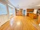 Open floor plan with hardwood floors that connects the kitchen and dining areas at 512 Clearwater Dr, Mcdonough, GA 30252