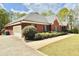Beautiful red brick home featuring attached garage, well maintained lawn and mature landscaping at 512 Clearwater Dr, Mcdonough, GA 30252