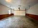 Spacious two-car garage with concrete floor, ample space and a garage door at 512 Clearwater Dr, Mcdonough, GA 30252