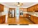 Spacious kitchen with wood cabinets, stainless steel appliances, and hardwood floors at 512 Clearwater Dr, Mcdonough, GA 30252