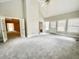 Spacious Living Room with lots of windows and open access to other rooms at 512 Clearwater Dr, Mcdonough, GA 30252