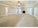 Spacious living room featuring a fireplace, and large neutral-colored carpet at 512 Clearwater Dr, Mcdonough, GA 30252